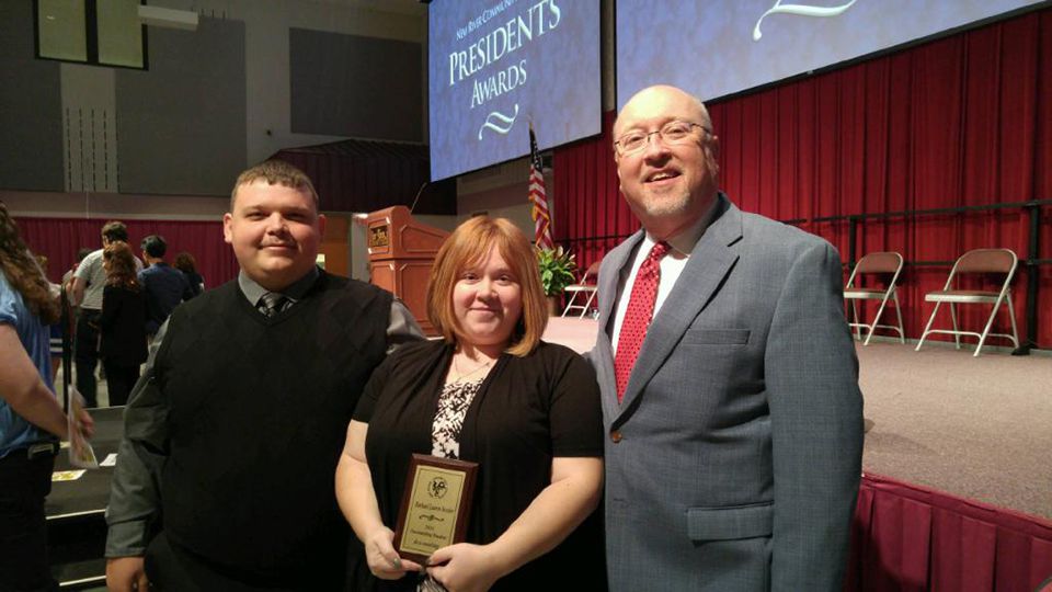 Pictured from left: Bessler's husband Joshua Bessler, Rachael Bessler, and T. Ray Wurzburger, Associate Professor of Accounting.