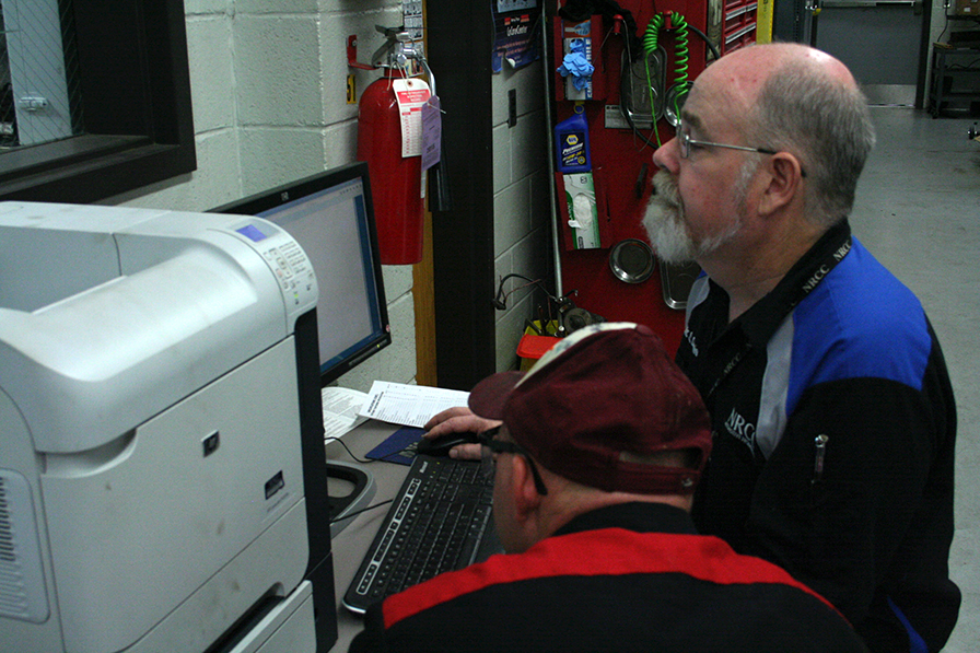 teacher and studnet in auto lab