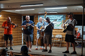 Five members of New River Line performing on stage